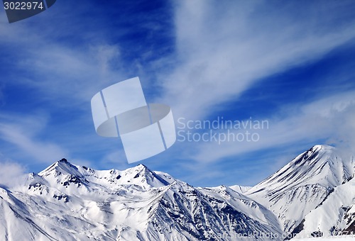 Image of Winter snowy mountains in windy day