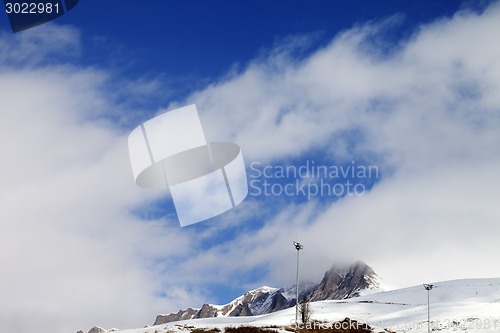 Image of Ski slope and blue sky with clouds