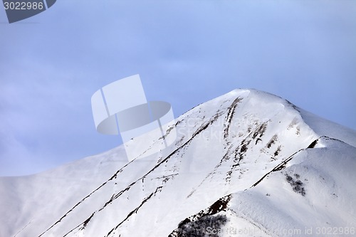 Image of Off-piste snowy slope in morning