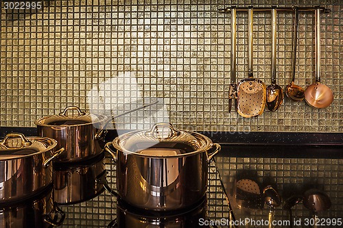 Image of gold kitchen utensils