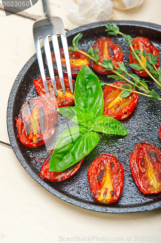 Image of baked cherry tomatoes with basil and thyme