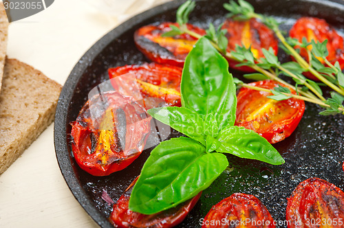 Image of baked cherry tomatoes with basil and thyme