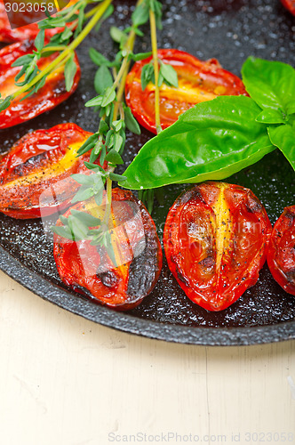 Image of baked cherry tomatoes with basil and thyme