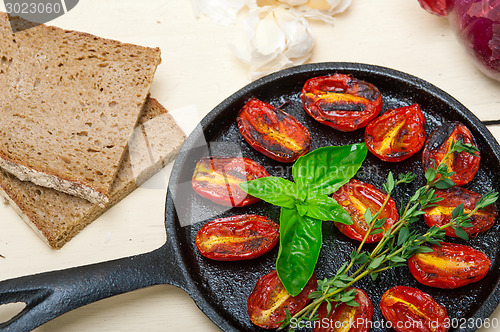 Image of baked cherry tomatoes with basil and thyme