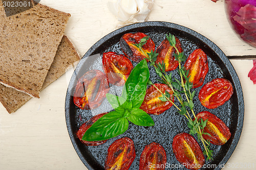 Image of baked cherry tomatoes with basil and thyme