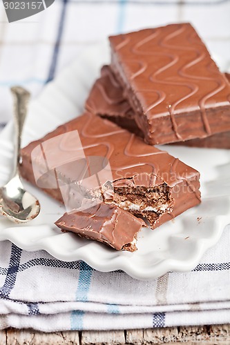 Image of dark chocolate cakes and spoon