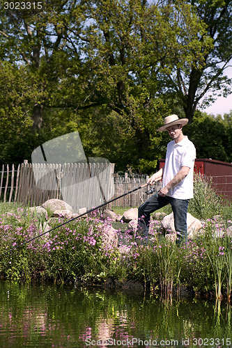 Image of Fishing man at the pond