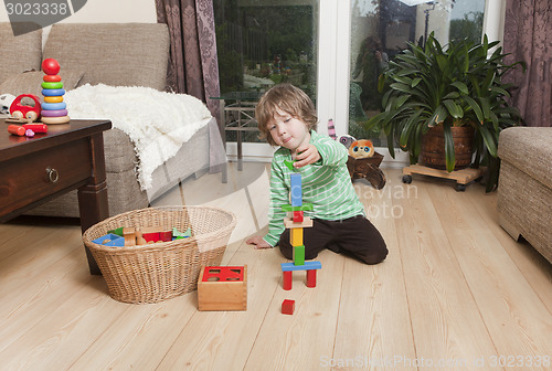 Image of boy playing with building blocks