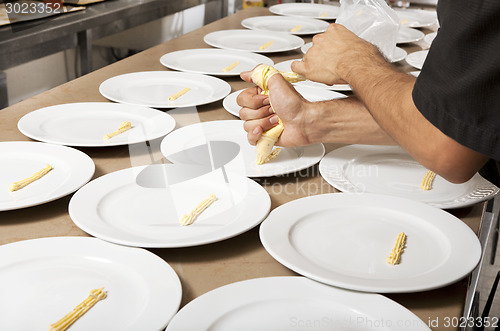 Image of chef prepares dishes