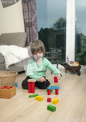 Image of boy playing on the flooring