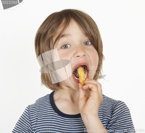 Image of boy with peanut flips in the mouth