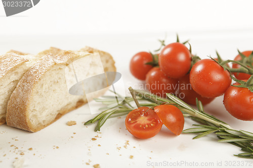 Image of bread slices with tomato and rosemary