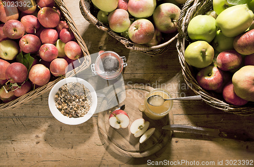 Image of cereal honey and many apples
