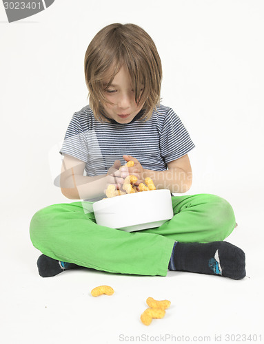 Image of Boy with bowl full of peanut flips