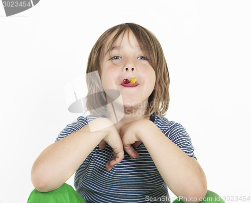 Image of boy eats gummy bears