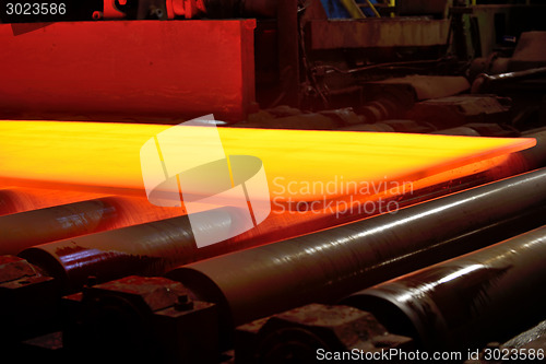 Image of hot steel on conveyor