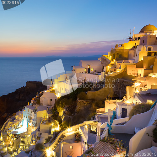 Image of Oia village on Santorini in sunset, Greece.