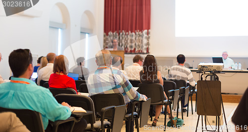 Image of Speaker at Business Conference and Presentation.