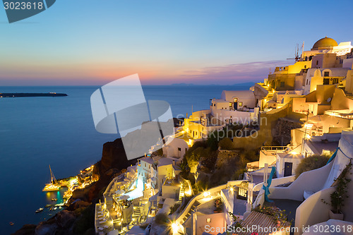 Image of Oia village on Santorini in sunset, Greece.