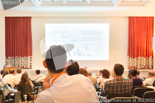 Image of Speaker at Business Conference and Presentation.