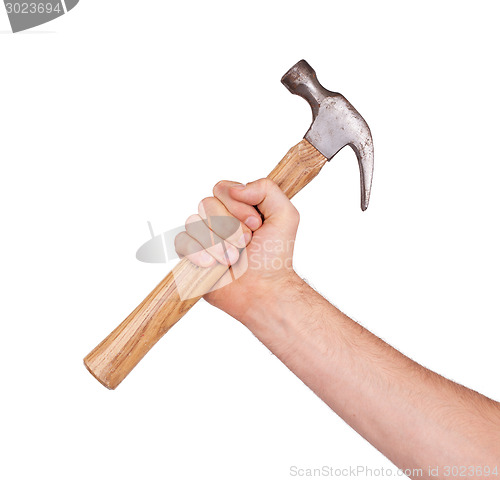 Image of Man's hand holding hammer