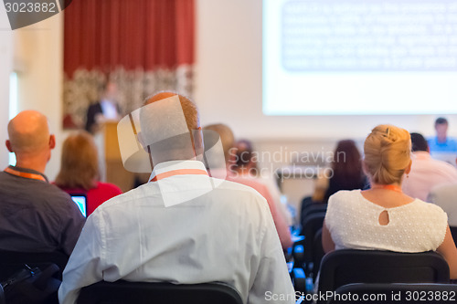 Image of Speaker at Business Conference and Presentation.