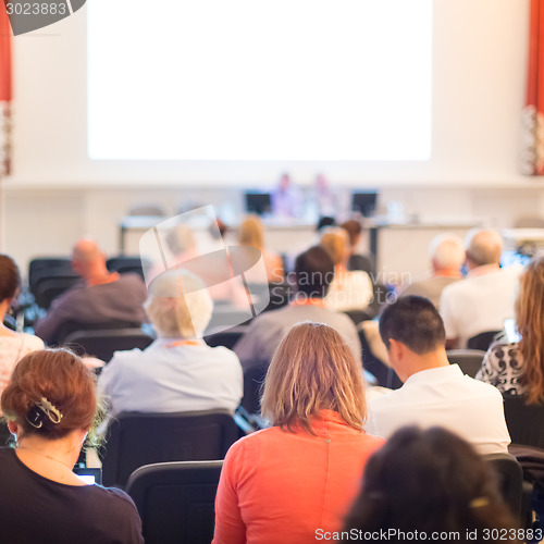 Image of Speaker at Business Conference and Presentation.