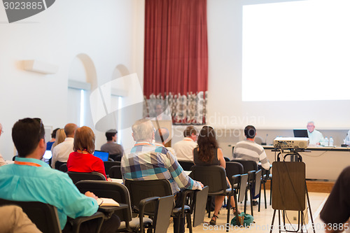 Image of Speaker at Business Conference and Presentation.