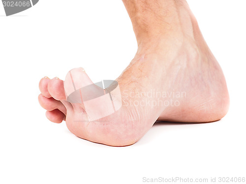 Image of Male foot stepping barefoot isolated against white