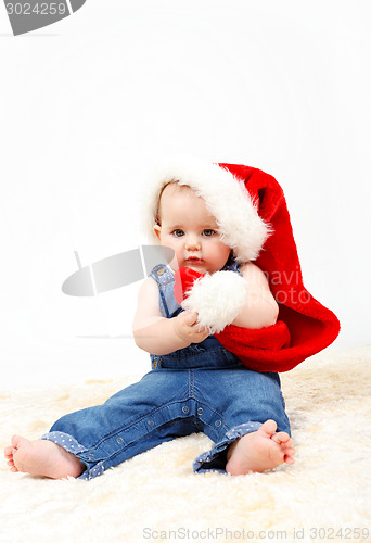 Image of Child girl with Christmas santa hat