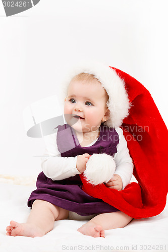 Image of Child girl with Christmas santa hat