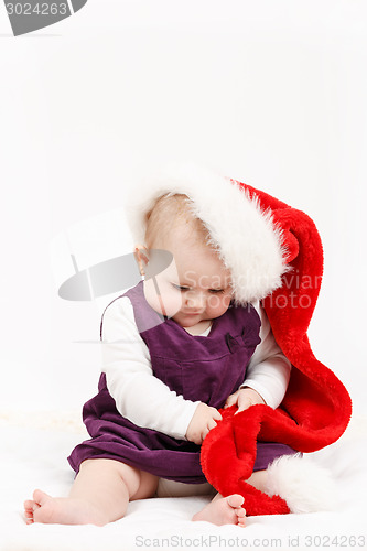 Image of Child girl with Christmas santa hat