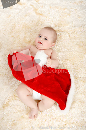 Image of Child girl with Christmas santa hat