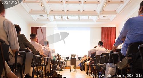 Image of Speaker at Business Conference and Presentation.