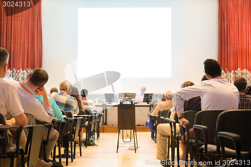 Image of Speaker at Business Conference and Presentation.