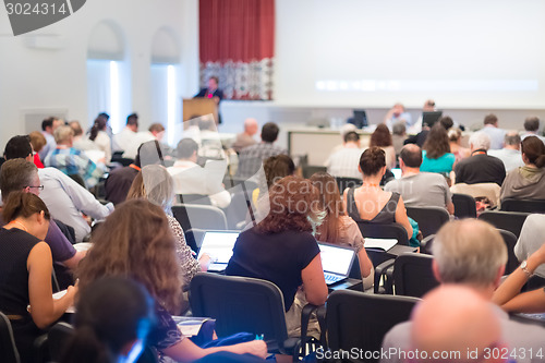 Image of Speaker at Business Conference and Presentation.