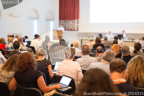 Image of Speaker at Business Conference and Presentation.