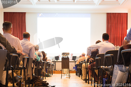 Image of Speaker at Business Conference and Presentation.