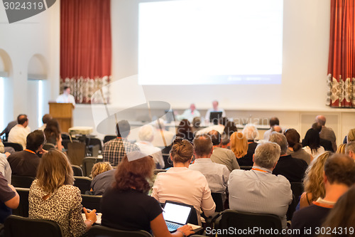 Image of Speaker at Business Conference and Presentation.