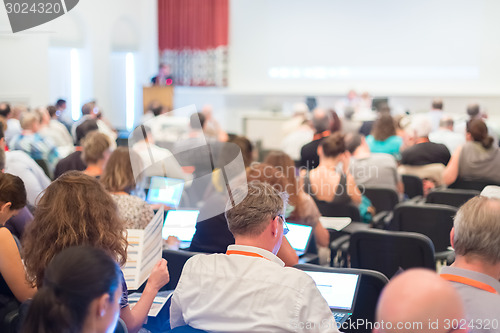 Image of Speaker at Business Conference and Presentation.