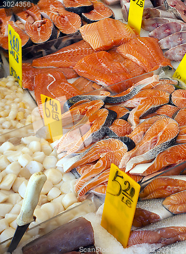 Image of frozen red fish steaks on a market 