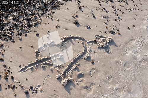 Image of Heart with Arrow in the sand