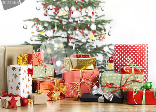 Image of christmas tree with lots of gifts