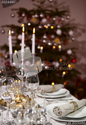 Image of laid table christmas tree vertical format