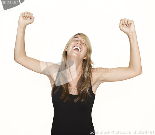 Image of Woman cheering with arms in the air