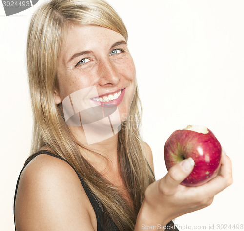 Image of laughing woman with apple