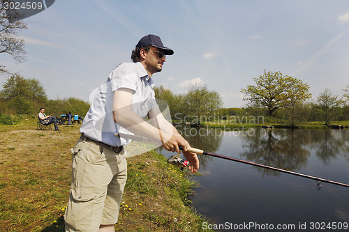 Image of Fisherman with rod in the hand