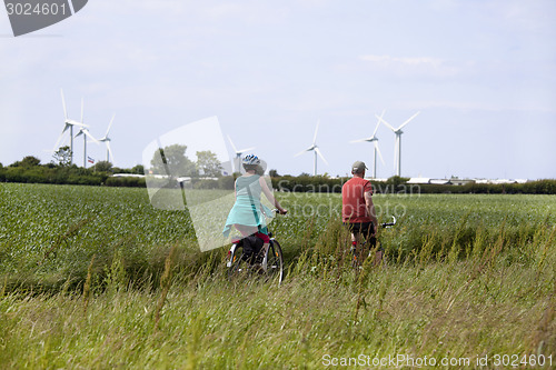 Image of pasture landscape with cyclists