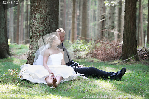 Image of Bride and groom in forest