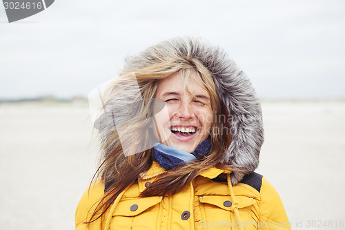 Image of laughing woman with hat